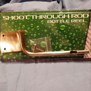 Shoot through rod bottle reel